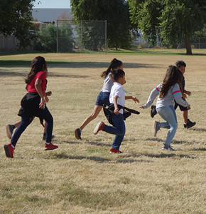 Students running on a field